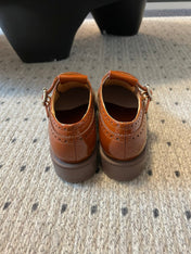 MIUMIU 26S CHURCH BROGUE MONK STRAP SHOES IN RUST ORANGE PATENT CALFSKIN