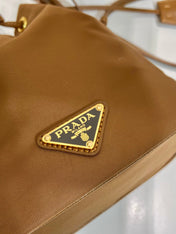 BUCKET BAG 19 IN RUSSET BROWN RE-NYLON AND CALFSKIN HANDLE