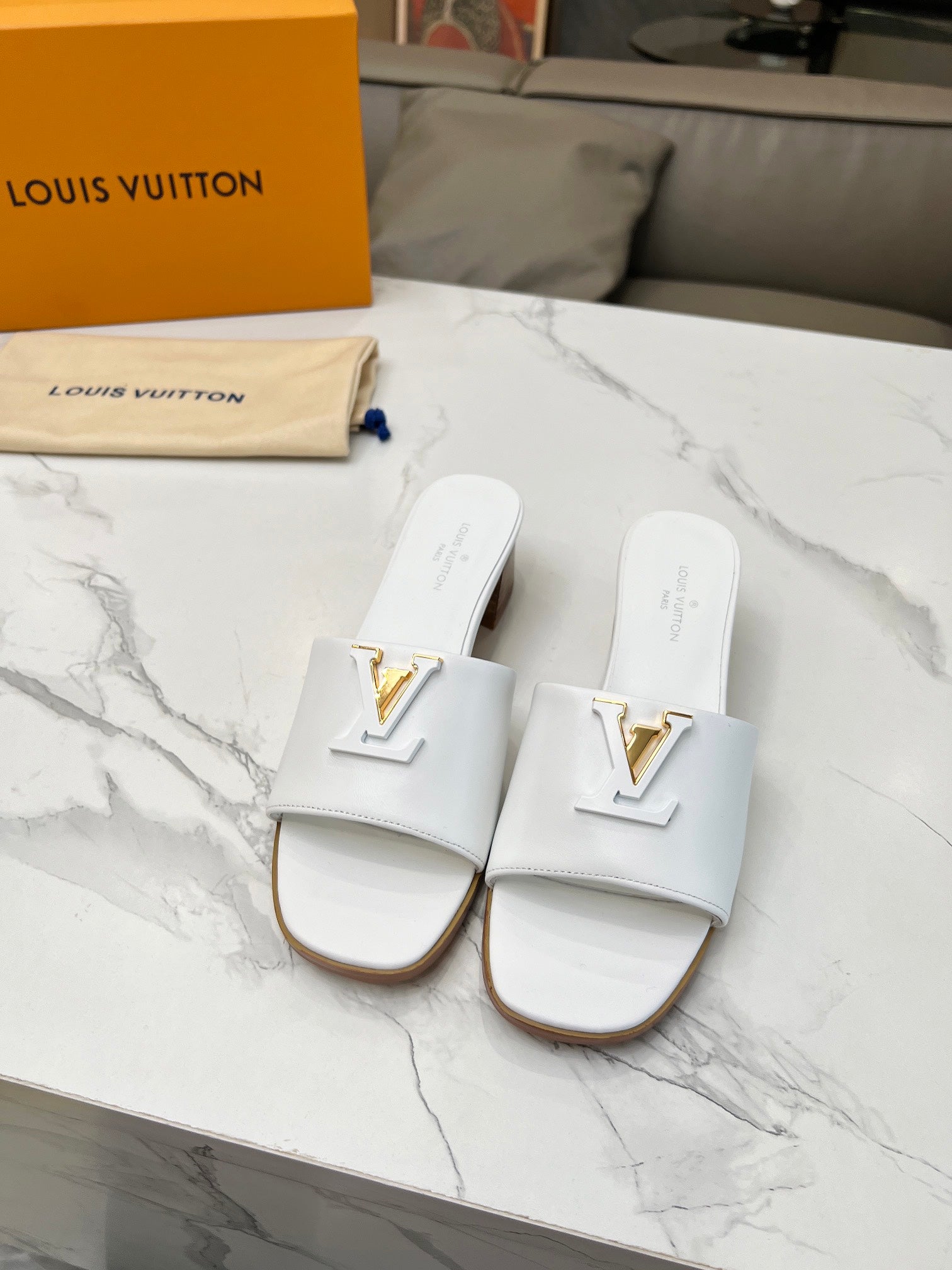 LV 26S CAPRI HIGH-HEELED MULES IN WHITE CALFSKIN