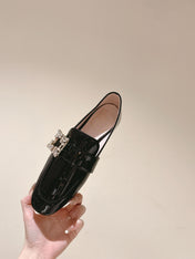 MINI BROCHE VIVIER BUCKLE LOAFERS IN BLACK PATENT CALFSKIN