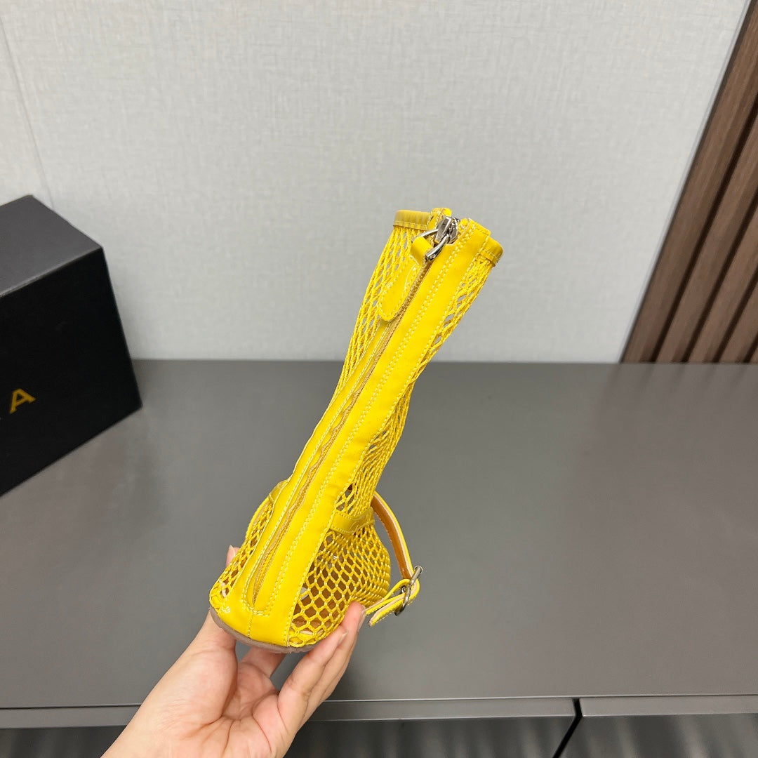 ALAIA SHORT BOOTS IN LEMON YELLOW MESH FISHNET