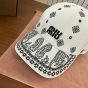 MM BASEBALL CAP IN WHITE WITH BLACK EMBROIDERED PATTERN