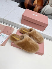 MIUMIU 26S MULES IN LIGHT BROWN SHEARLING 