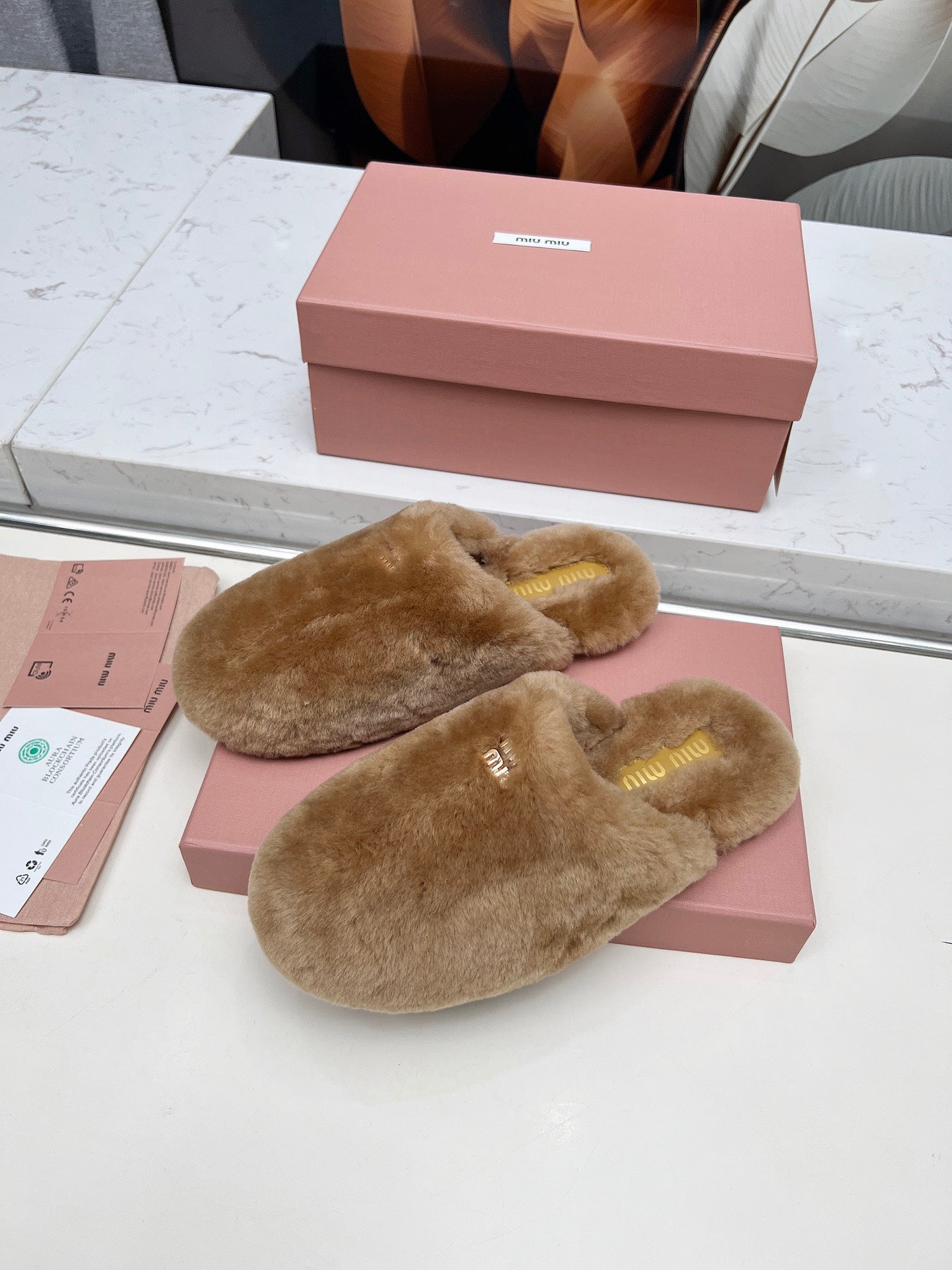 MIUMIU 26S MULES IN LIGHT BROWN SHEARLING 