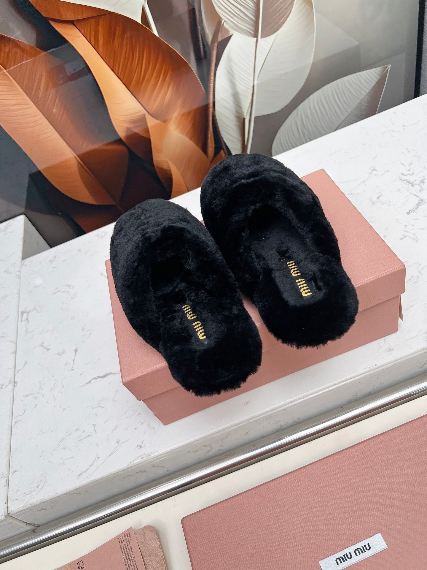 MIUMIU 26S MULES IN BLACK SHEARLING