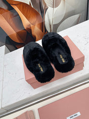 MIUMIU 26S MULES IN BLACK SHEARLING