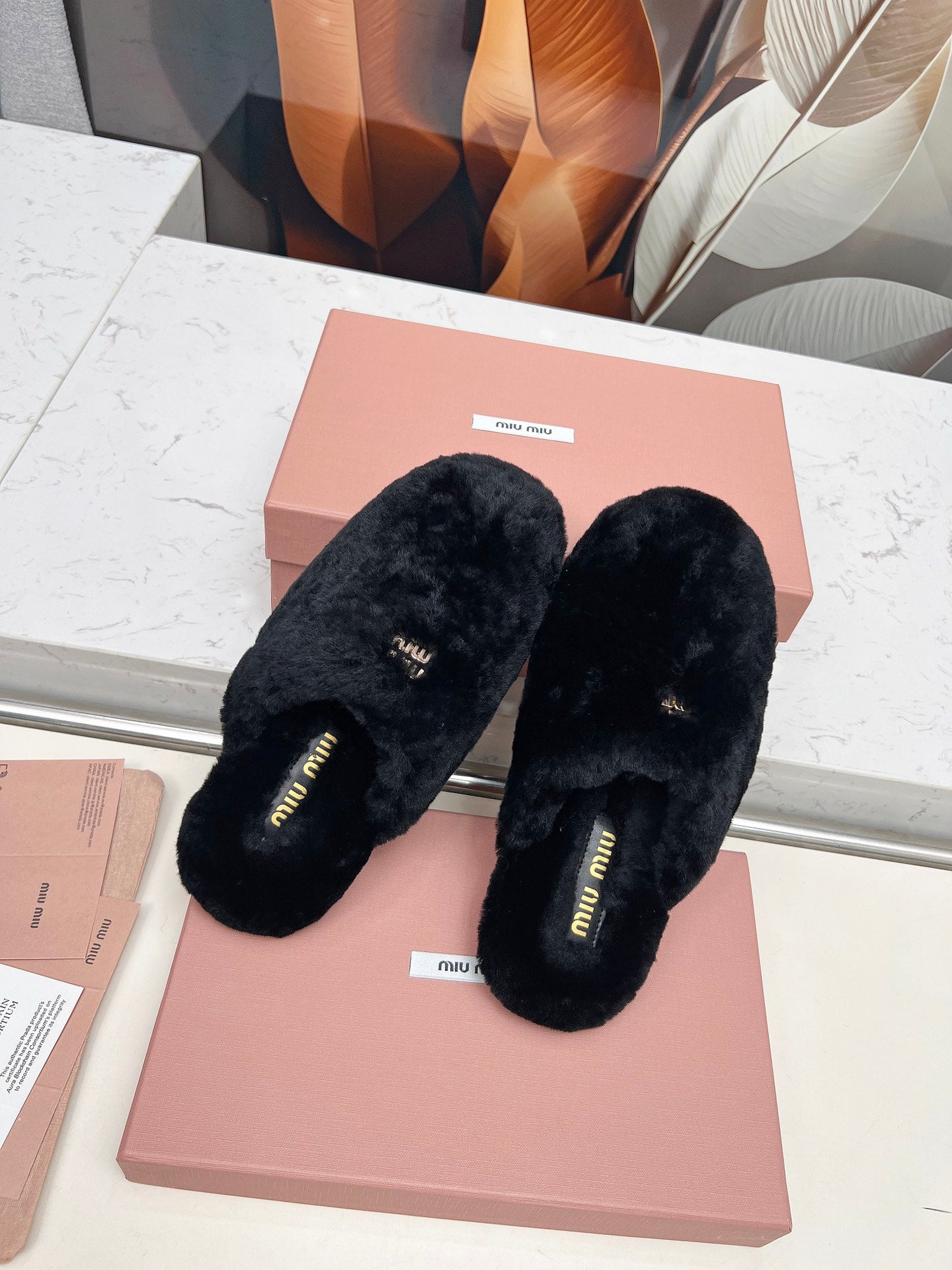 MIUMIU 26S MULES IN BLACK SHEARLING