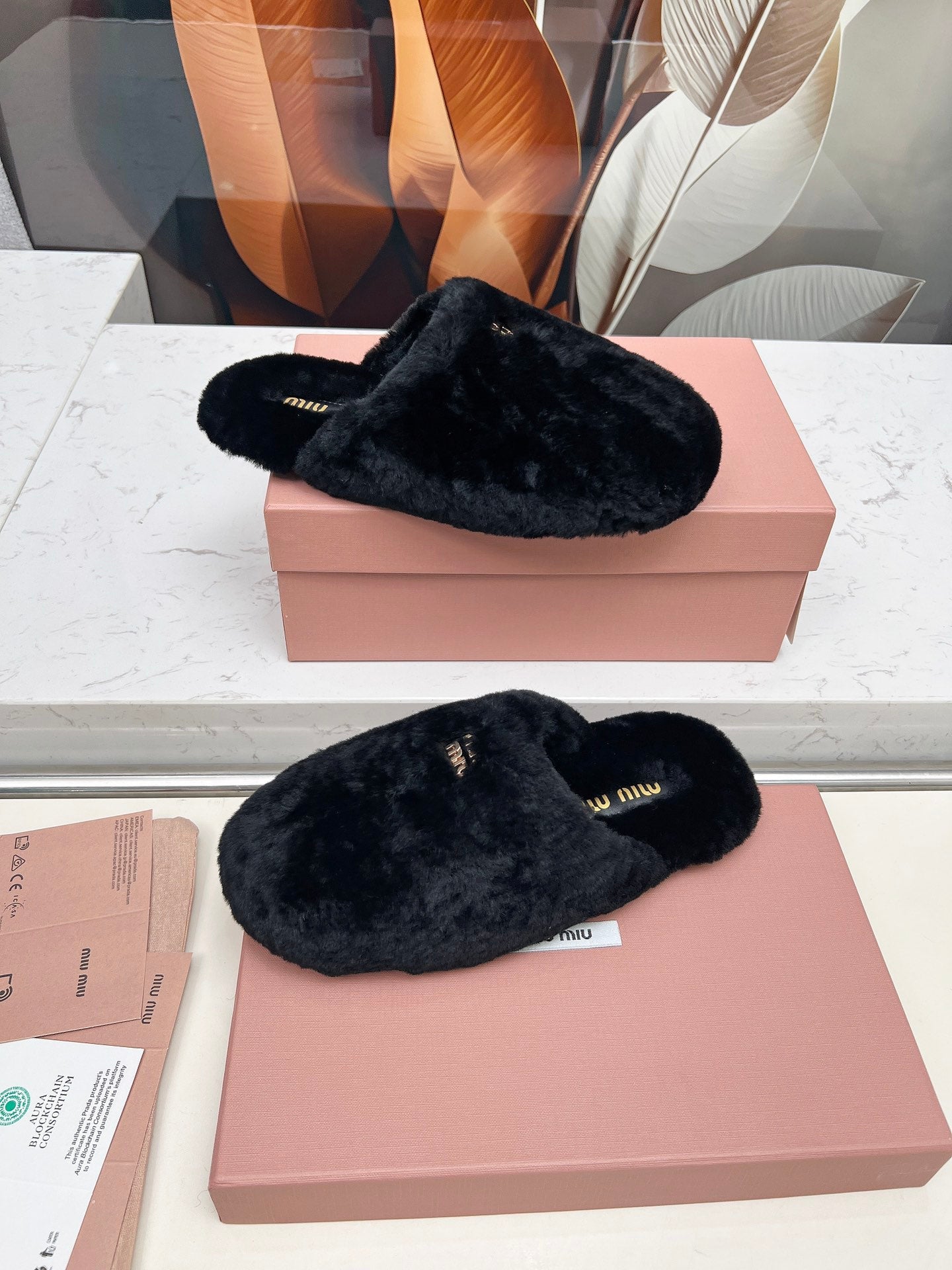 MIUMIU 26S MULES IN BLACK SHEARLING