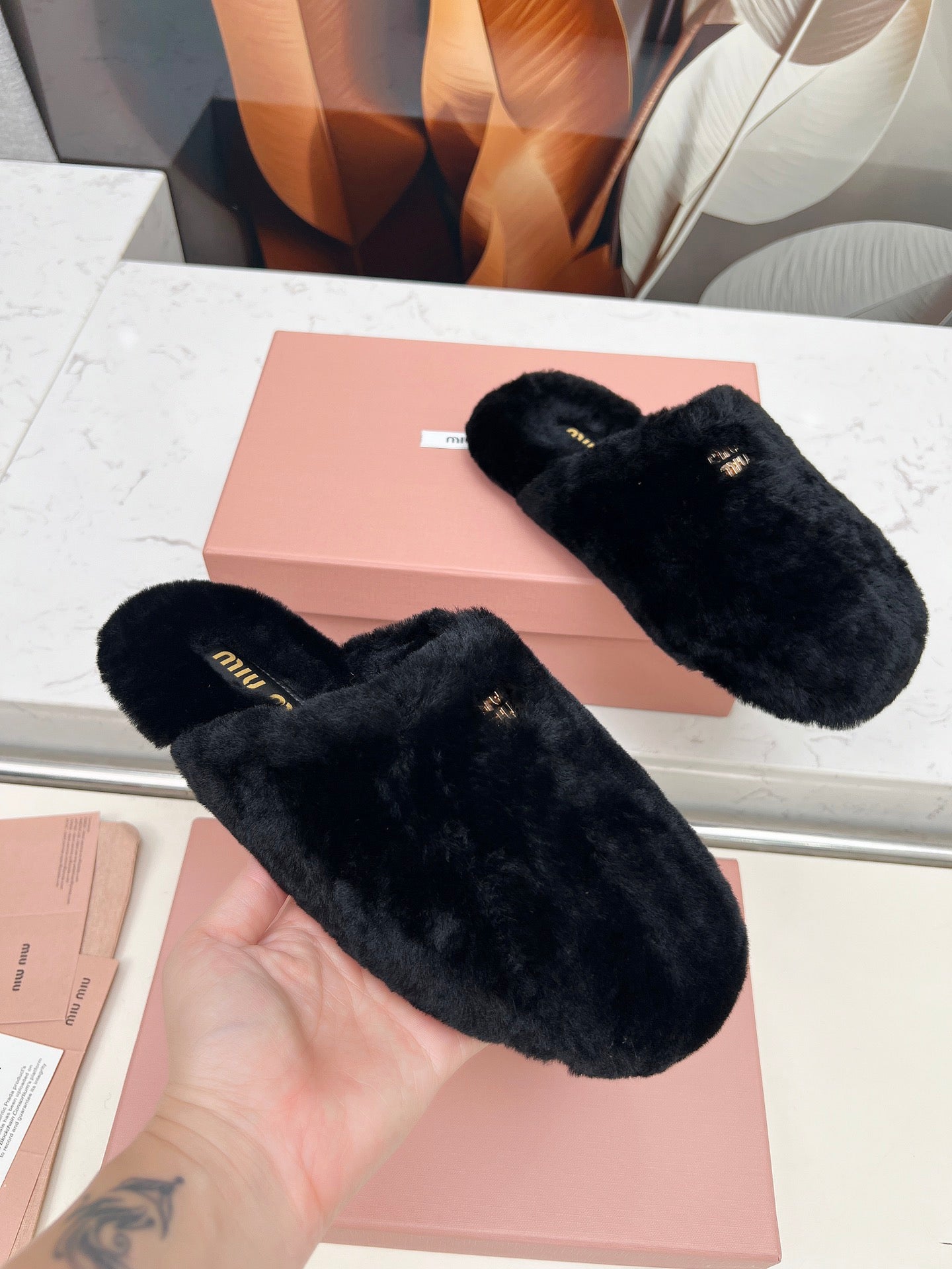 MIUMIU 26S MULES IN BLACK SHEARLING