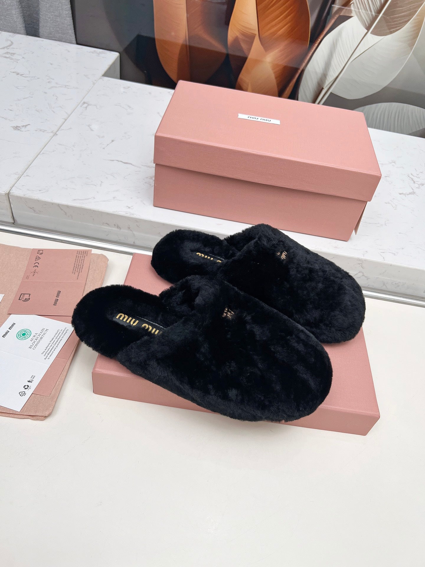 MIUMIU 26S MULES IN BLACK SHEARLING