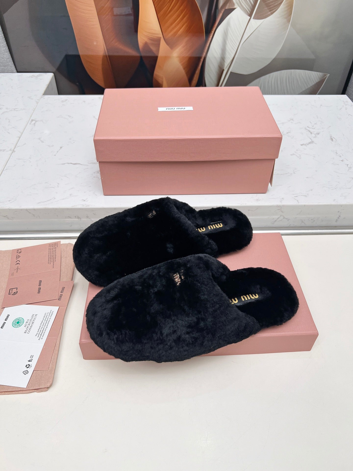 MIUMIU 26S MULES IN BLACK SHEARLING