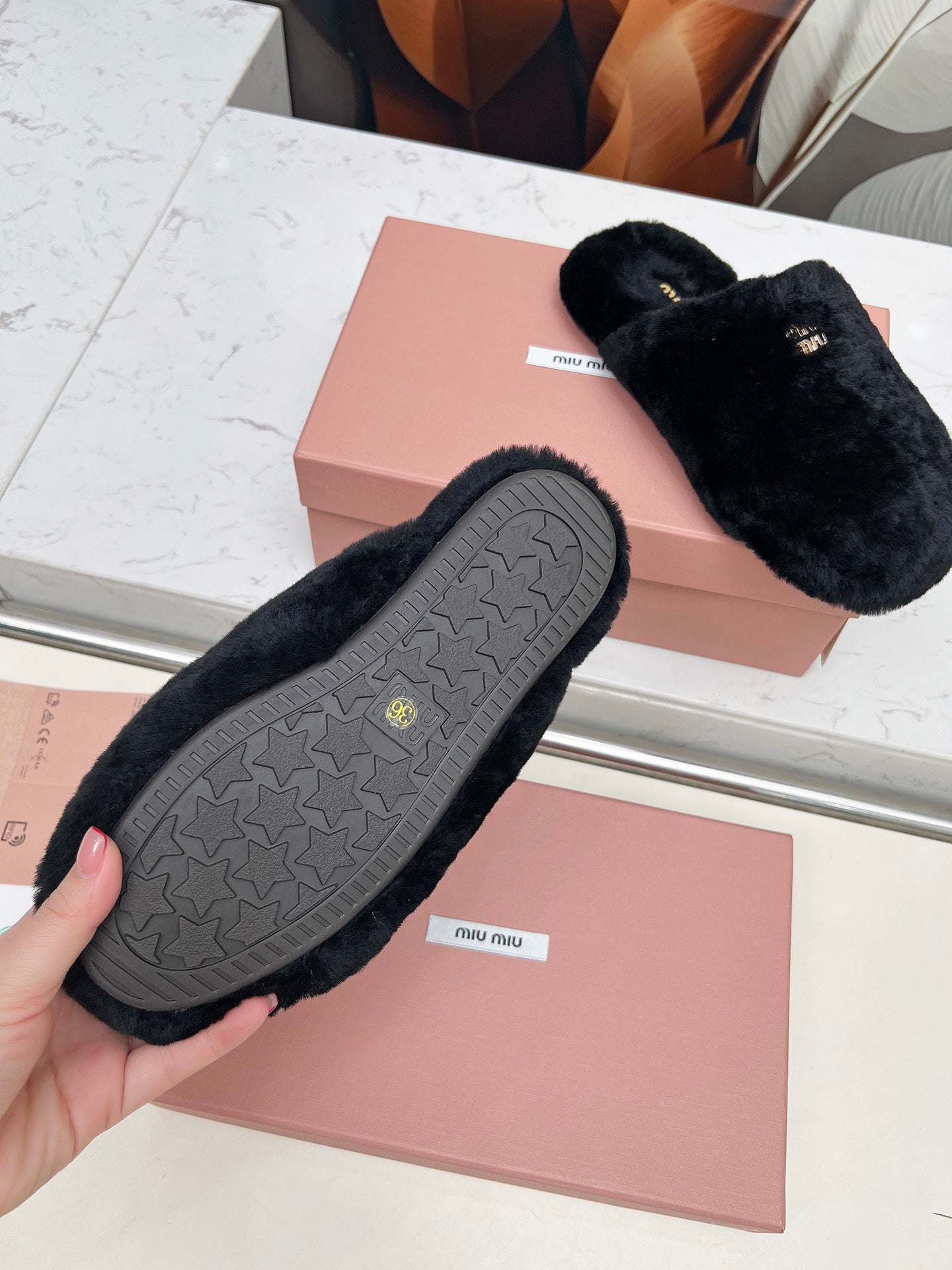 MIUMIU 26S MULES IN BLACK SHEARLING