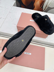 MIUMIU 26S MULES IN BLACK SHEARLING