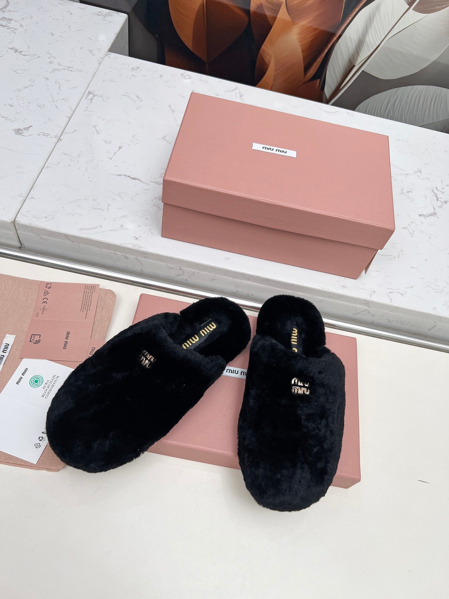 MIUMIU 26S MULES IN BLACK SHEARLING