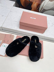 MIUMIU 26S MULES IN BLACK SHEARLING