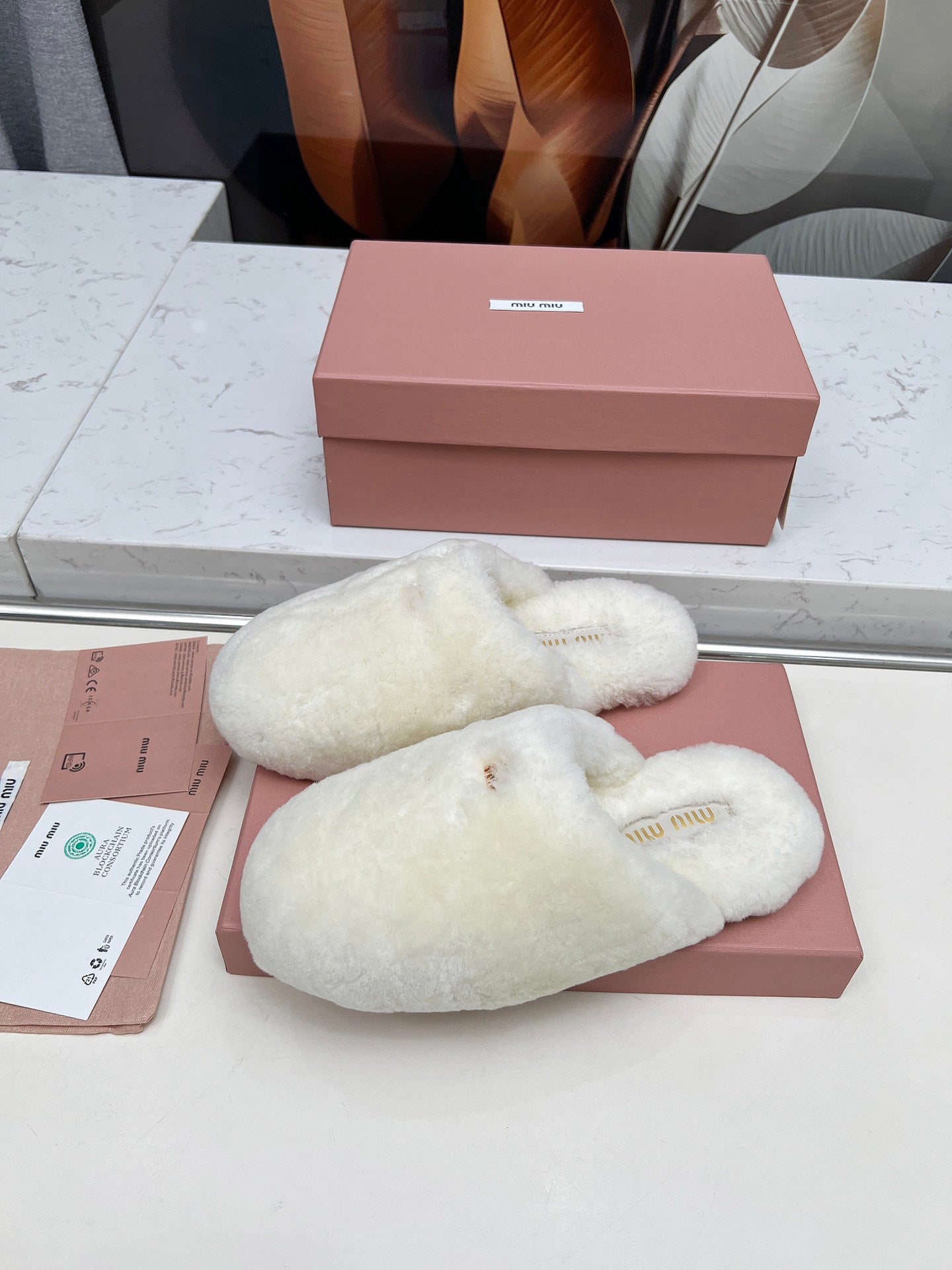 MIUMIU 26S MULES IN CREAM WHITE SHEARLING