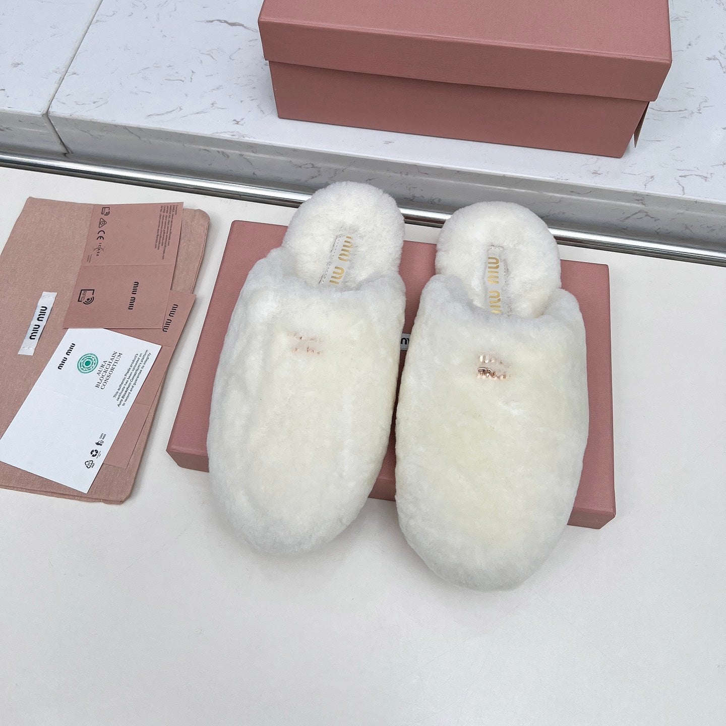 MIUMIU 26S MULES IN CREAM WHITE SHEARLING