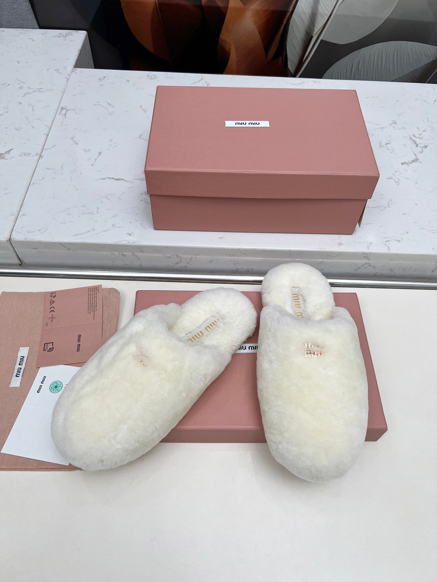 MIUMIU 26S MULES IN CREAM WHITE SHEARLING