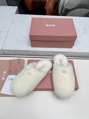 MIUMIU 26S MULES IN CREAM WHITE SHEARLING