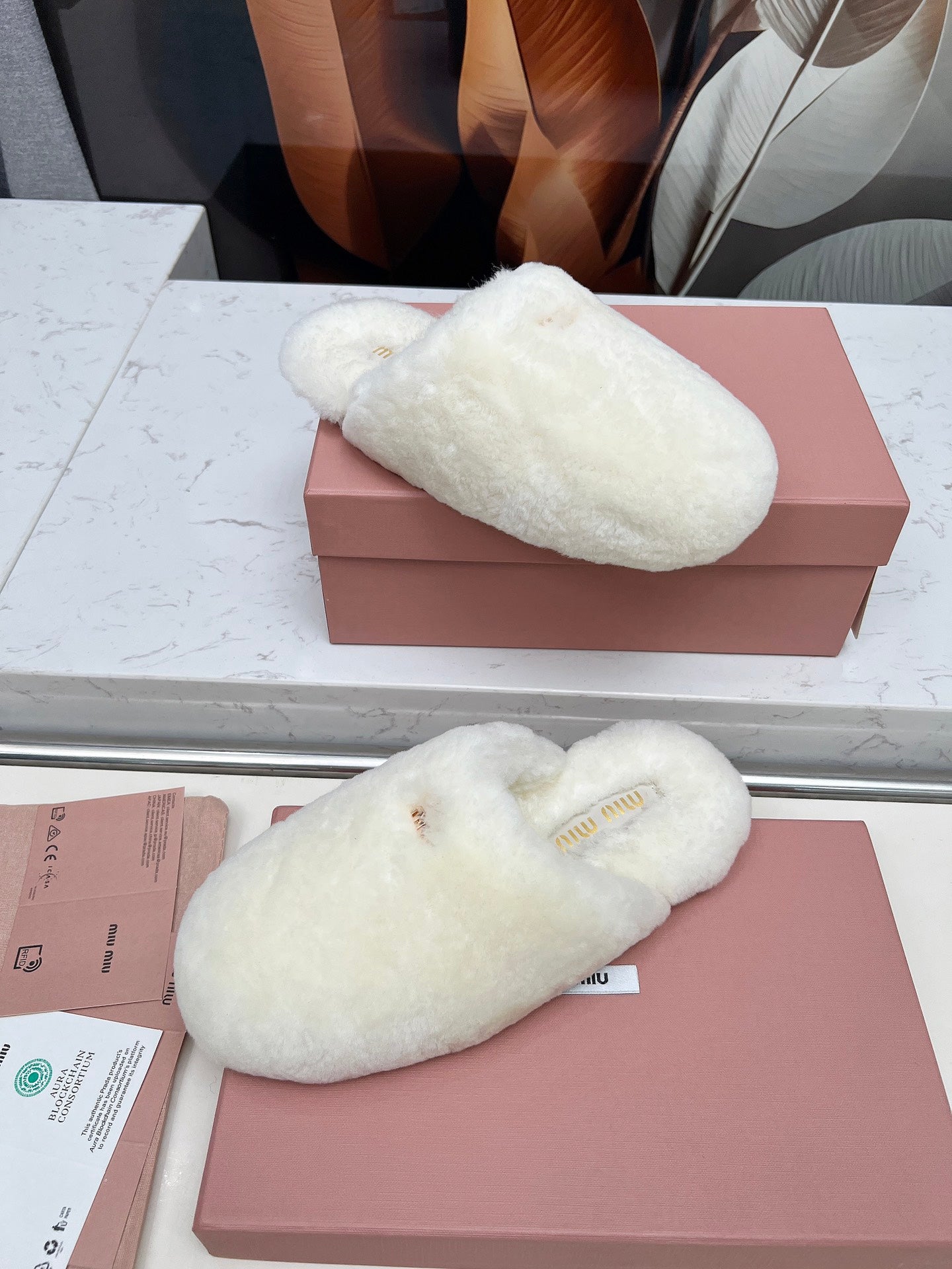 MIUMIU 26S MULES IN CREAM WHITE SHEARLING