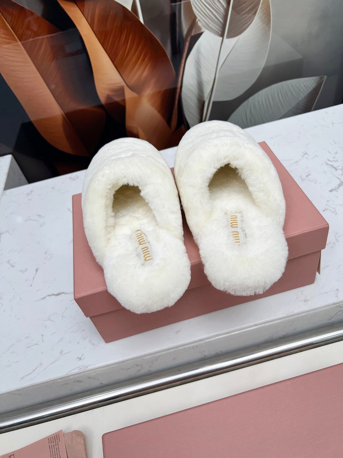 MIUMIU 26S MULES IN CREAM WHITE SHEARLING