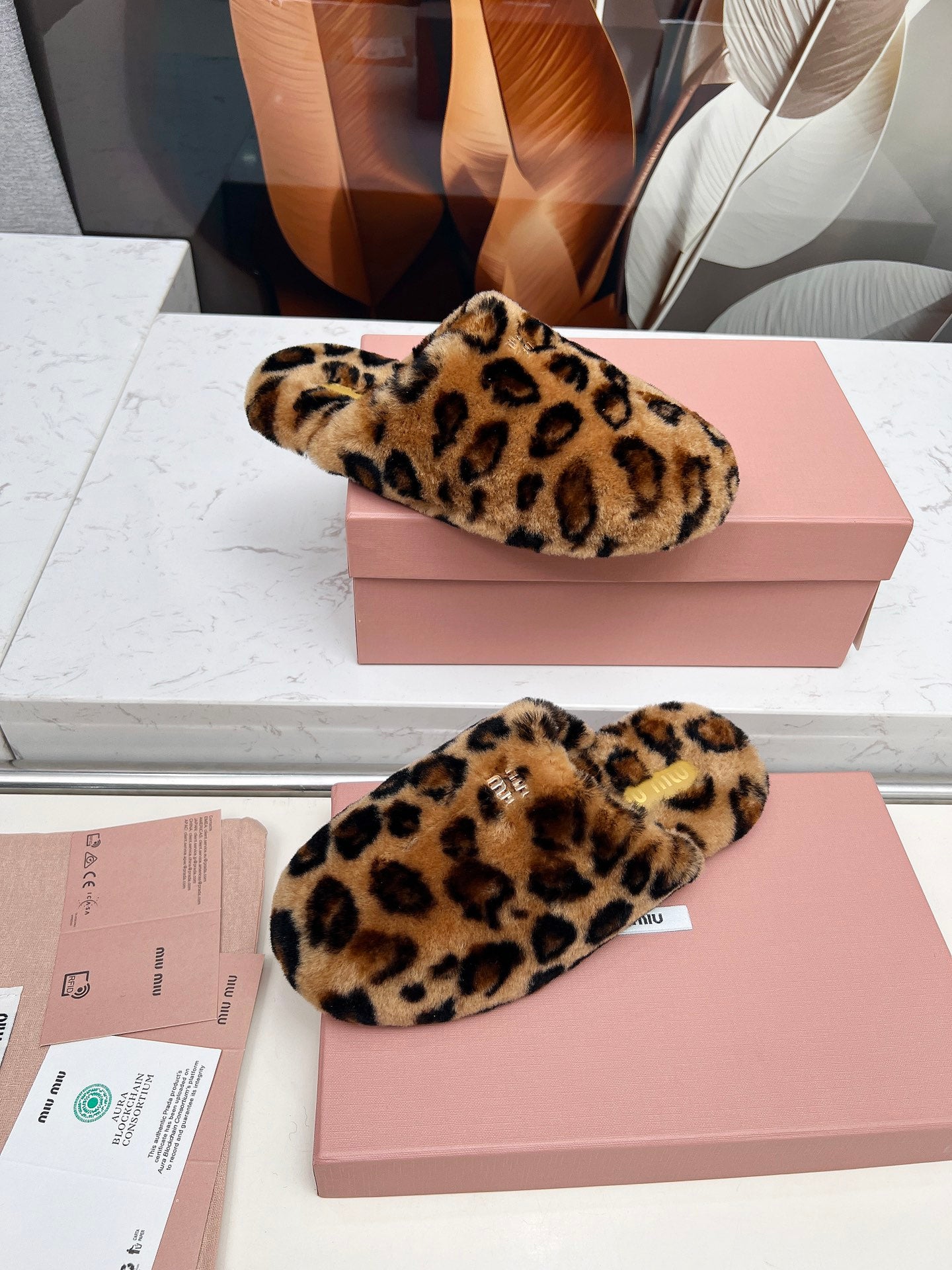 MIUMIU 26S MULES IN LEOPARD PATTERN SHEARLING 