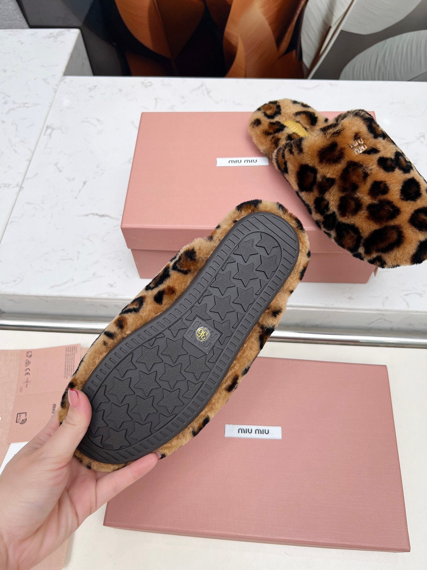 MIUMIU 26S MULES IN LEOPARD PATTERN SHEARLING 