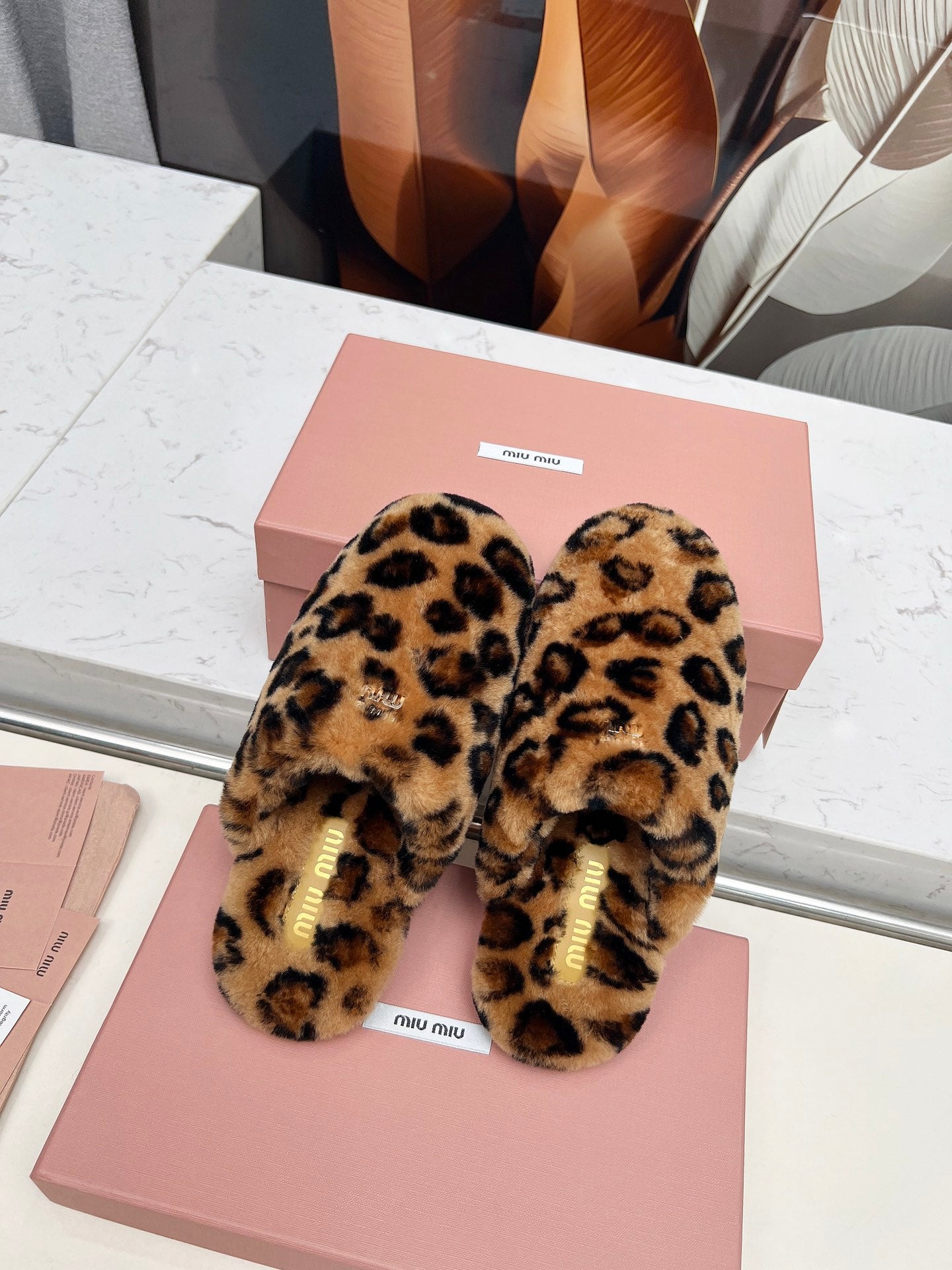 MIUMIU 26S MULES IN LEOPARD PATTERN SHEARLING 
