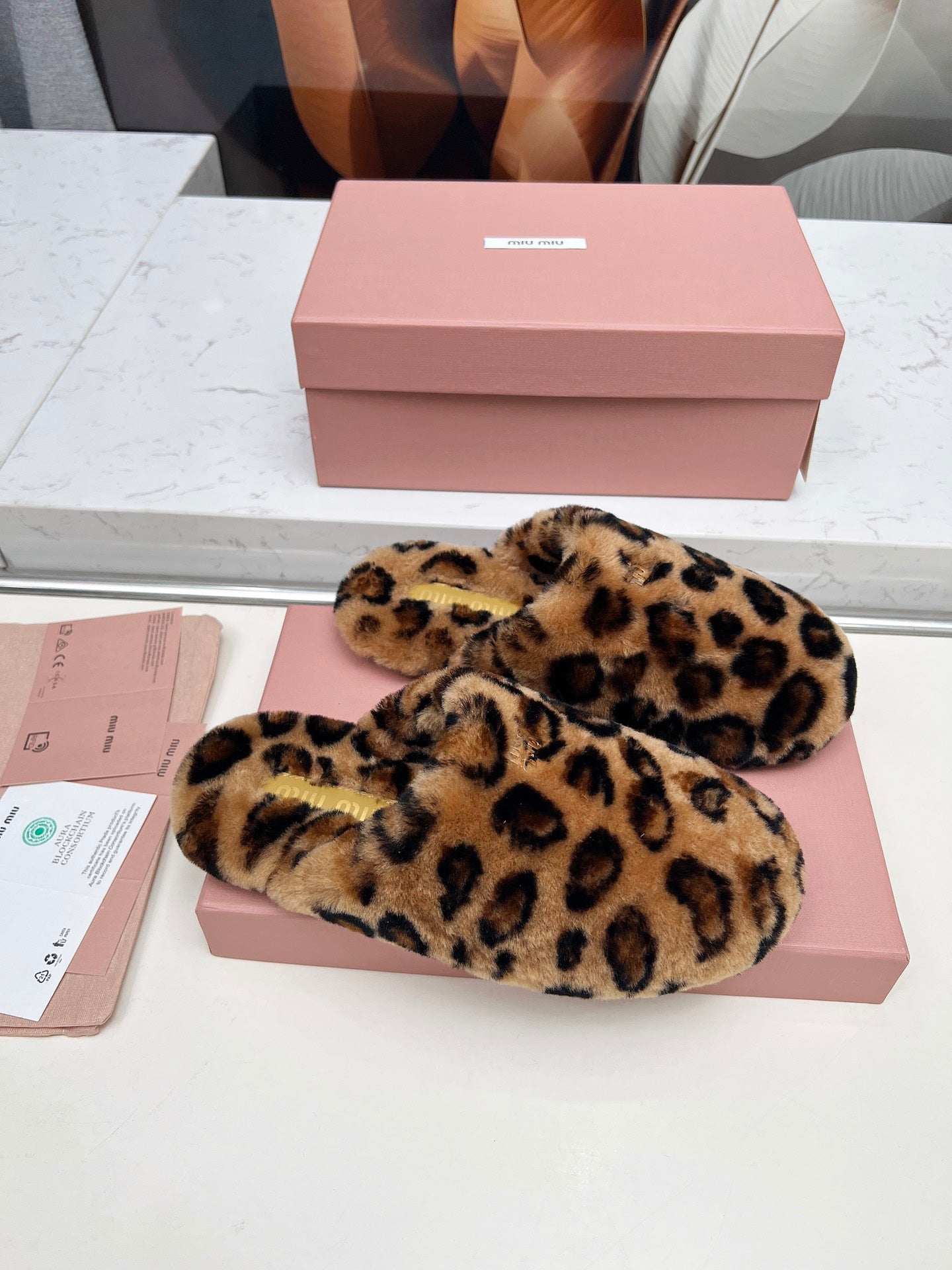 MIUMIU 26S MULES IN LEOPARD PATTERN SHEARLING 