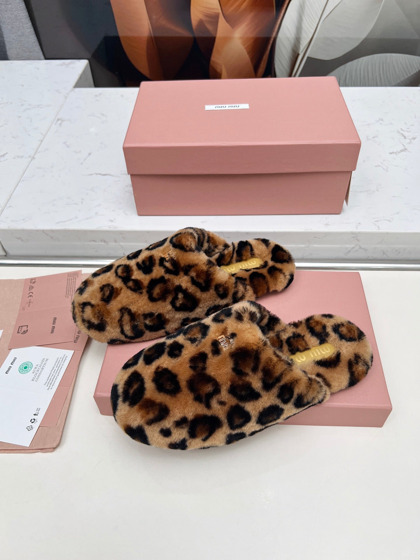 MIUMIU 26S MULES IN LEOPARD PATTERN SHEARLING 