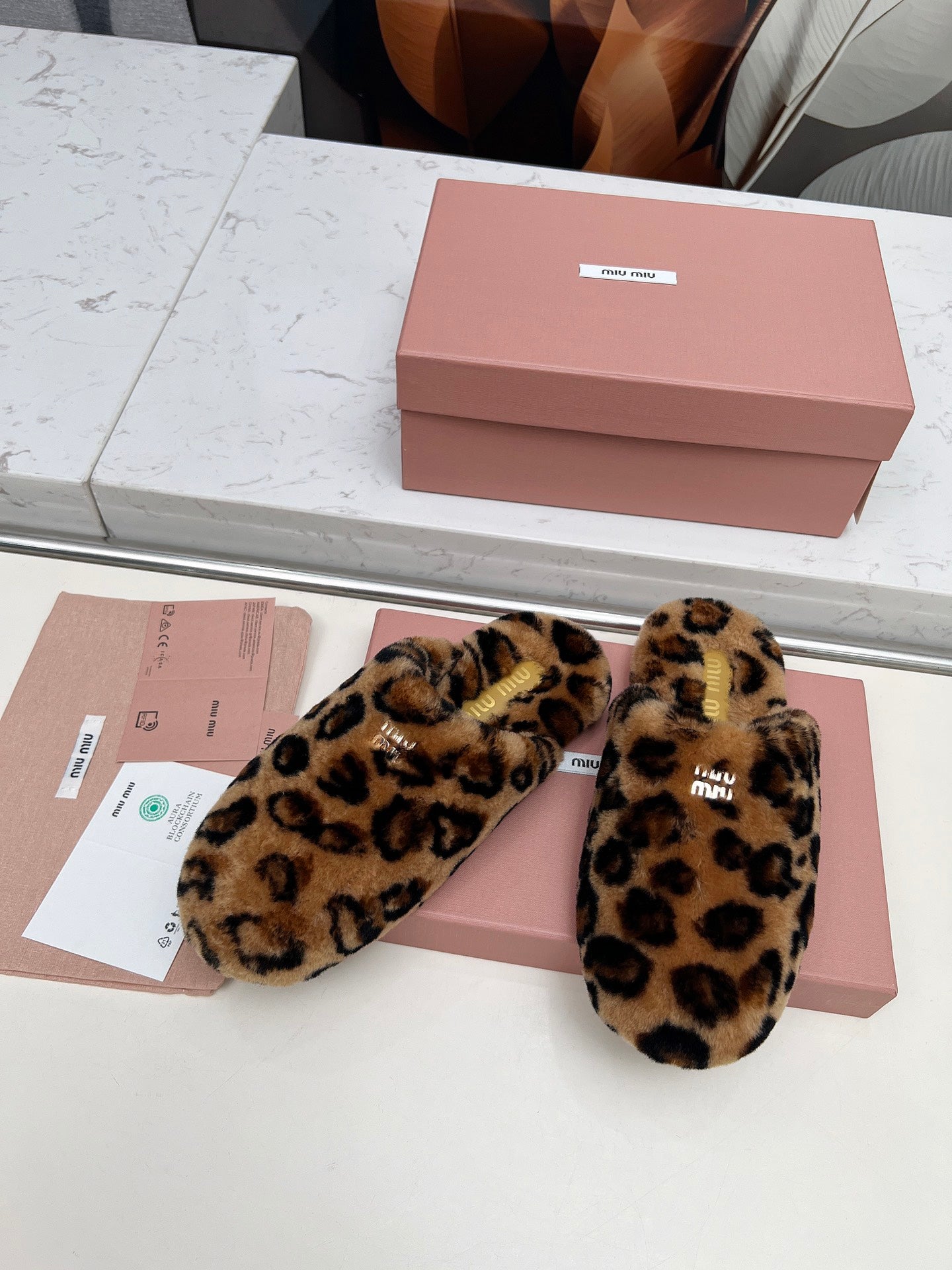 MIUMIU 26S MULES IN LEOPARD PATTERN SHEARLING 