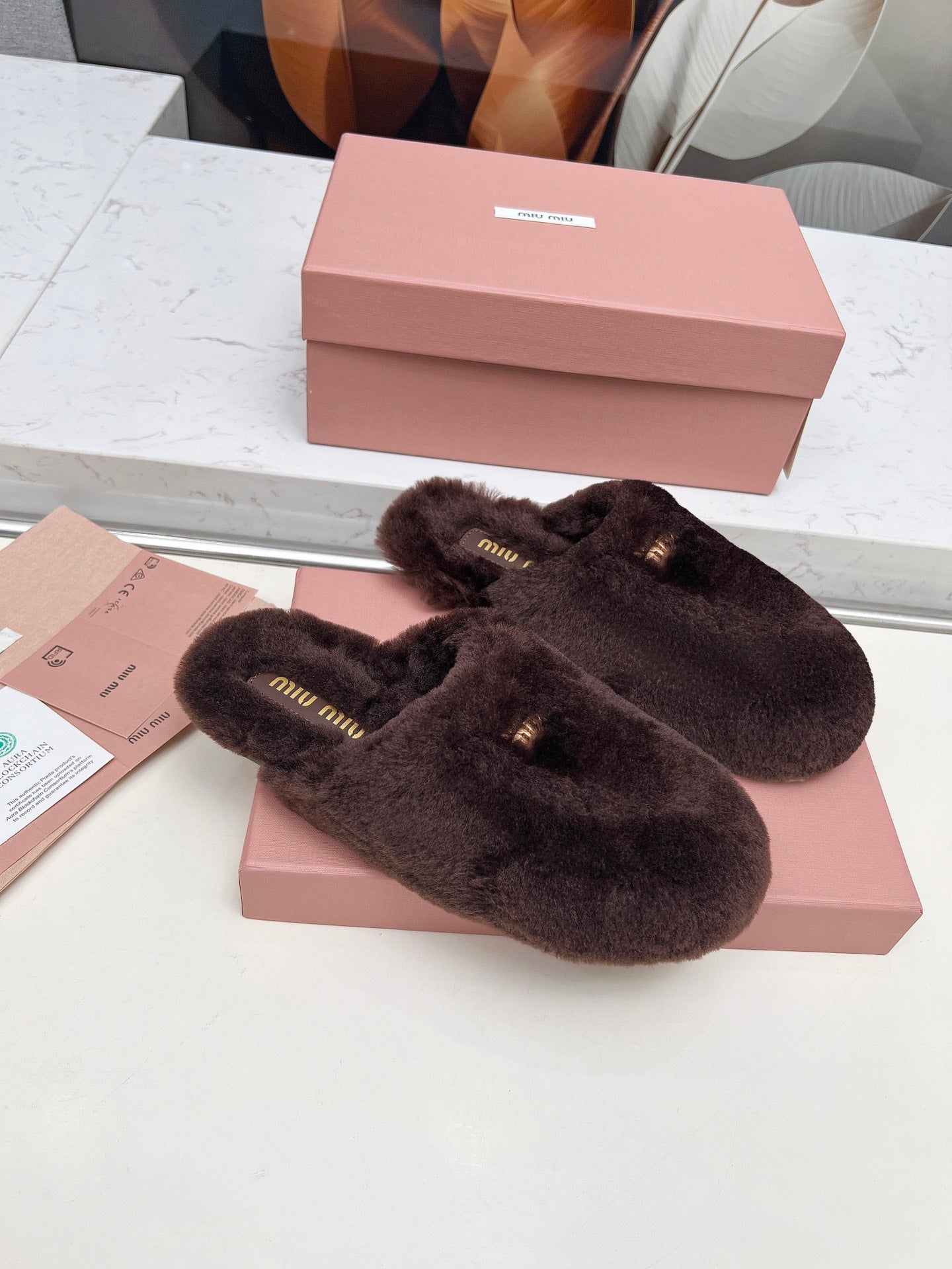 MIUMIU 26S MULES IN DARK BROWN SHEARLING 
