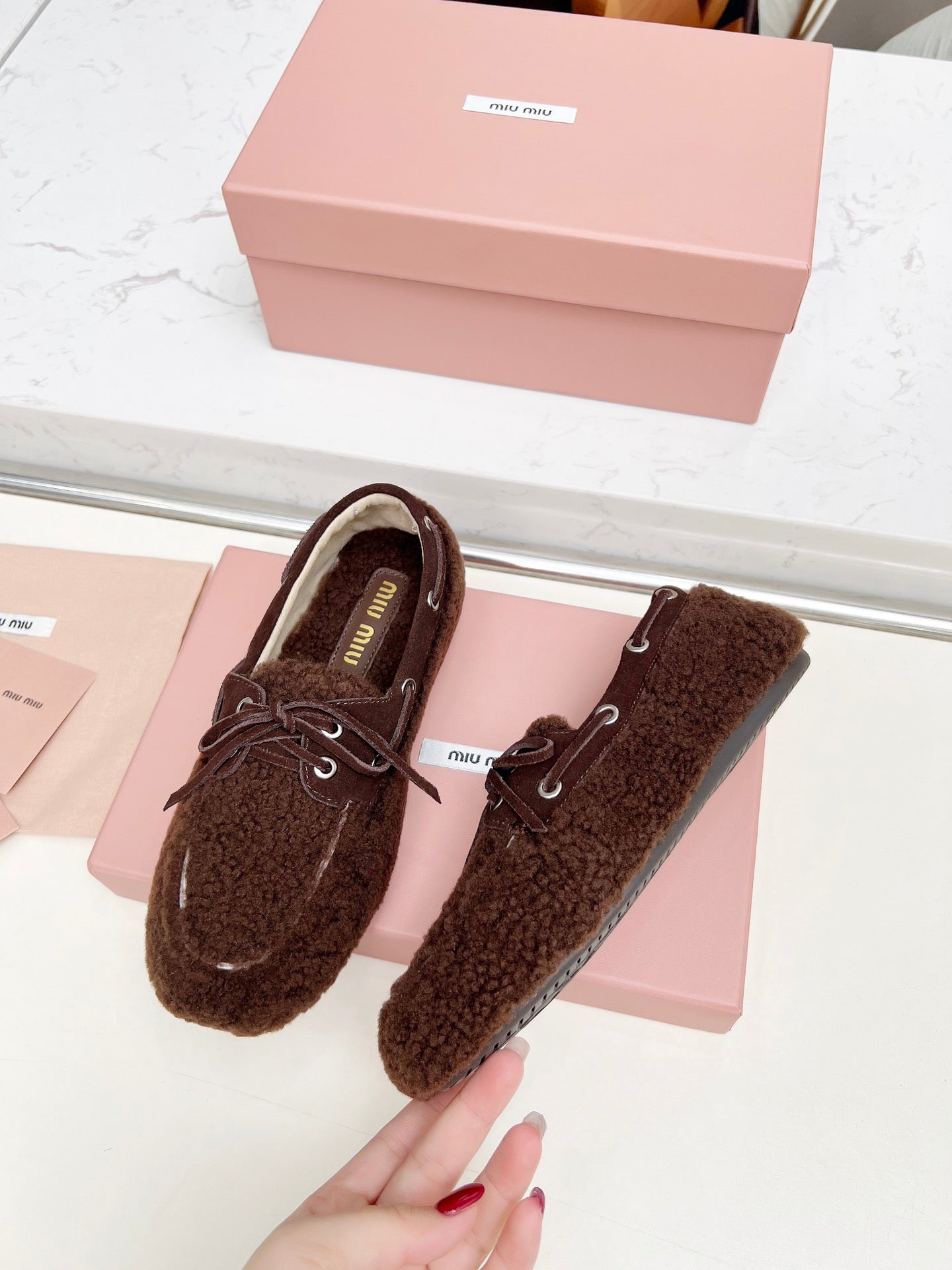 MIUMIU 26S BOAT LOAFERS IN DARK BROWN SHEARLING