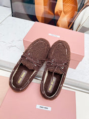 MIUMIU 26S BOAT LOAFERS IN DARK BROWN SHEARLING