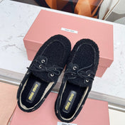 MIUMIU 26S BOAT LOAFERS IN BLACK SHEARLING