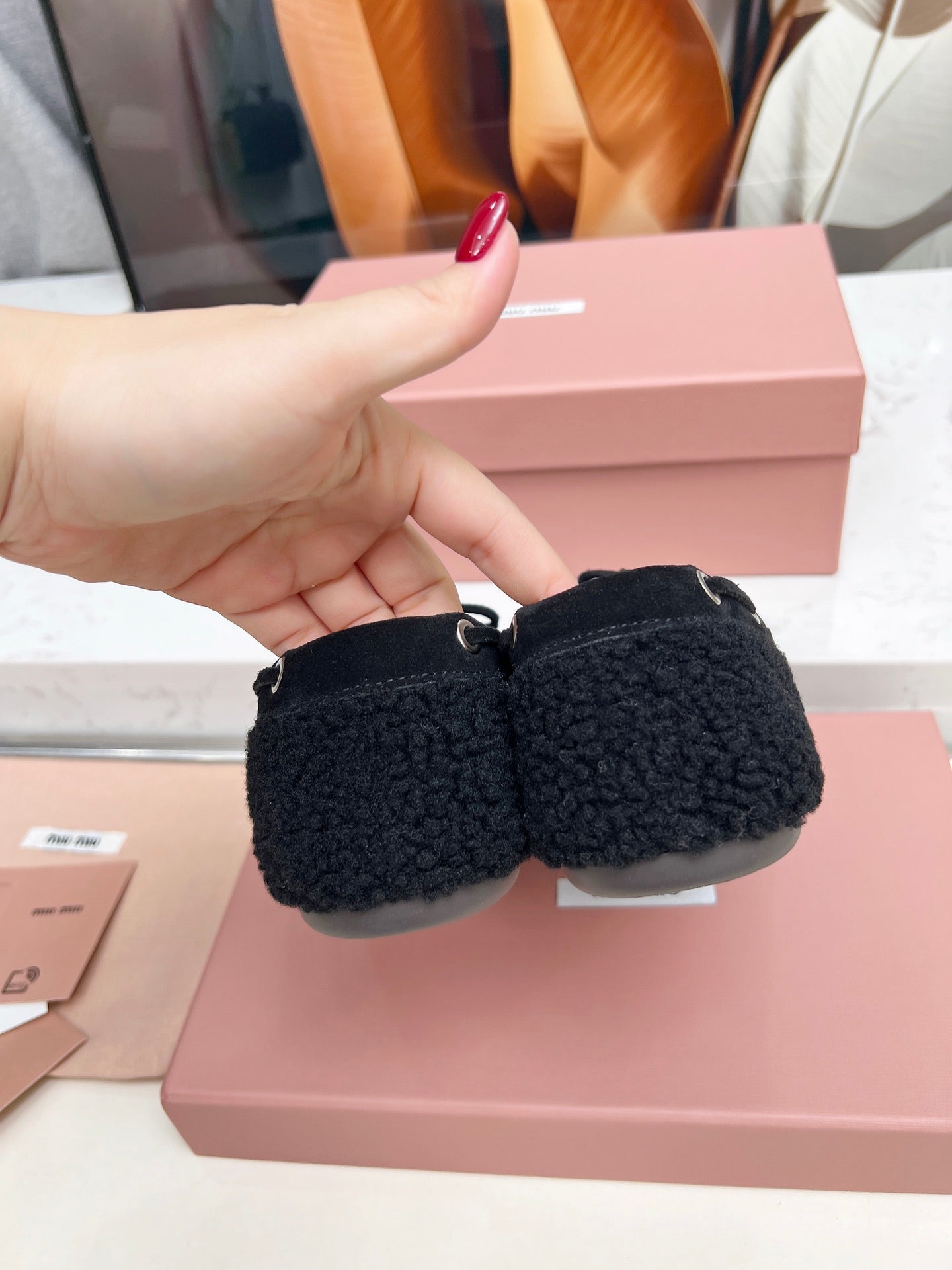 MIUMIU 26S BOAT LOAFERS IN BLACK SHEARLING