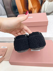 MIUMIU 26S BOAT LOAFERS IN BLACK SHEARLING