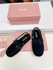 MIUMIU 26S BOAT LOAFERS IN BLACK SHEARLING