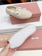 MIUMIU 26S BOAT LOAFERS IN BEIGE SHEARLING