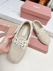 MIUMIU 26S BOAT LOAFERS IN BEIGE SHEARLING