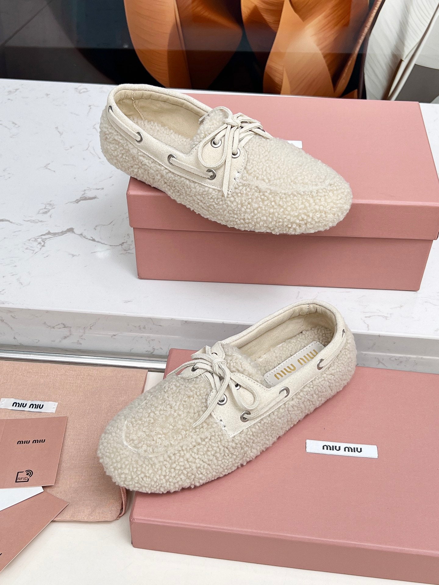 MIUMIU 26S BOAT LOAFERS IN BEIGE SHEARLING