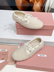 MIUMIU 26S BOAT LOAFERS IN BEIGE SHEARLING