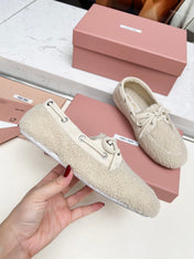 MIUMIU 26S BOAT LOAFERS IN BEIGE SHEARLING
