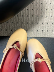 BOTTEGA VENETA 26S FLAT MULES IN BEIGE LAMBSKIN