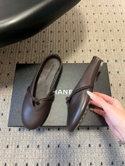 BOTTEGA VENETA 26S FLAT MULES IN DARK BROWN LAMBSKIN