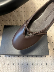 BOTTEGA VENETA 26S FLAT MULES IN DARK BROWN LAMBSKIN