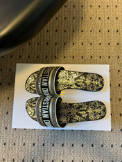 DIOR 26S DWAY SLIDE COTTON EMBROIDERED IN BLACK AND GOLD FLORAL MOTIF