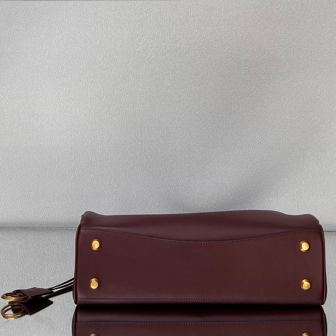 RODEO MEDIUM BAG 35 IN BURGUNDY SMOOTH CALFSKIN GOLD HARDWARE