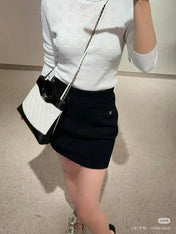 CC ICONIC SKIRT IN BLACK WOOL KNIT WITH FRONT POCKETS