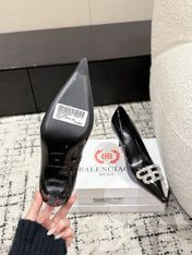 POINTED HIGH PUMPS IN BLACK PATENT CALFSKIN WITH CRYSTAL BUCKLE